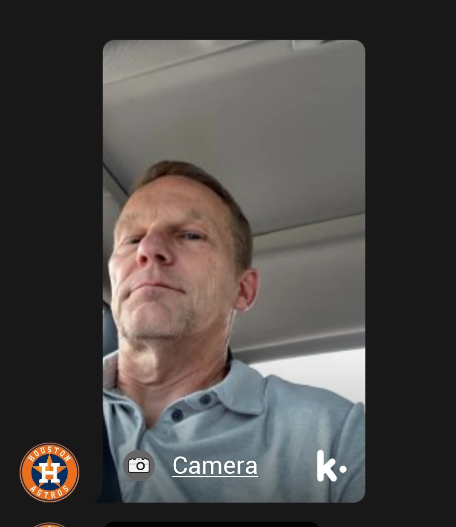 a selfie of Clay, taken from a low angle in his car